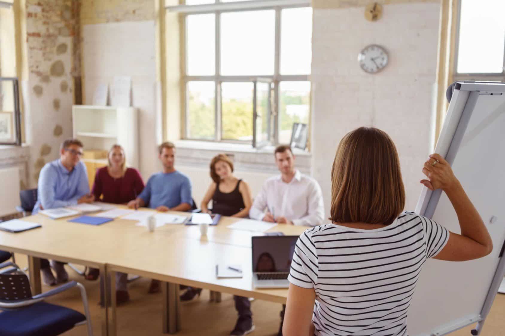 HR leader showcasing her ideas to the organisation in a board meeting